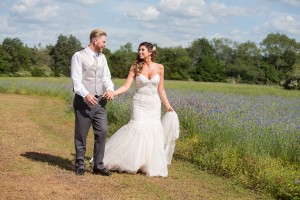 purple flowers field bride groom