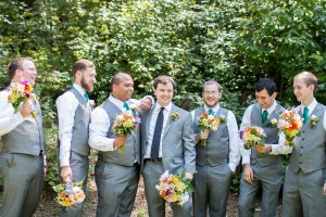 groomsmen holding bouquets wedding