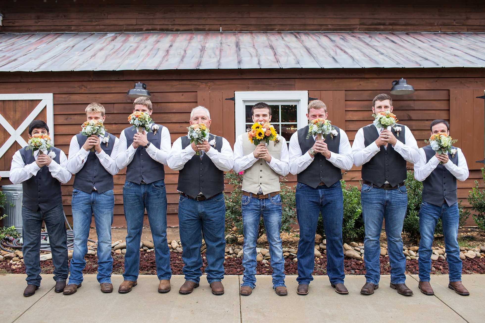 groomsmen holding bouquet