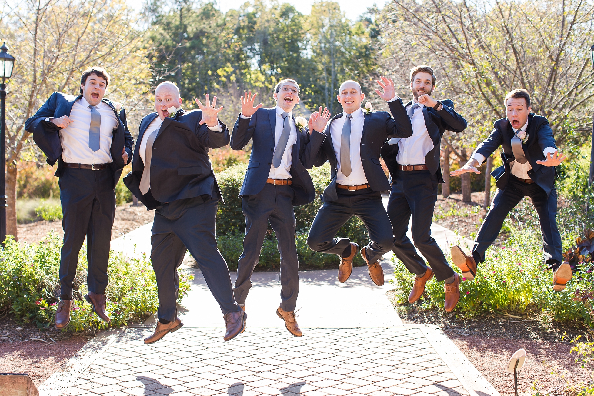 groomsmen jumping botanical gardens