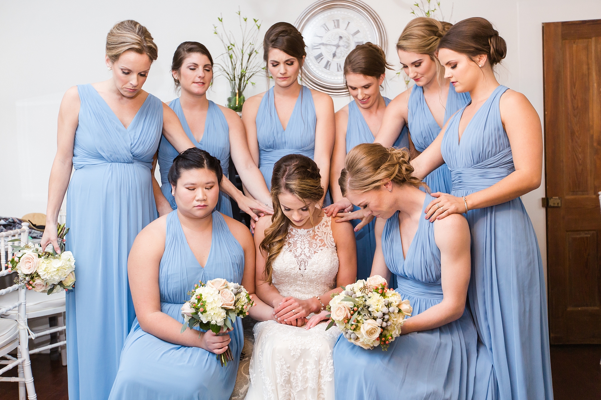 bride bridesmaids praying