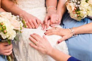 praying wedding bridesmaids