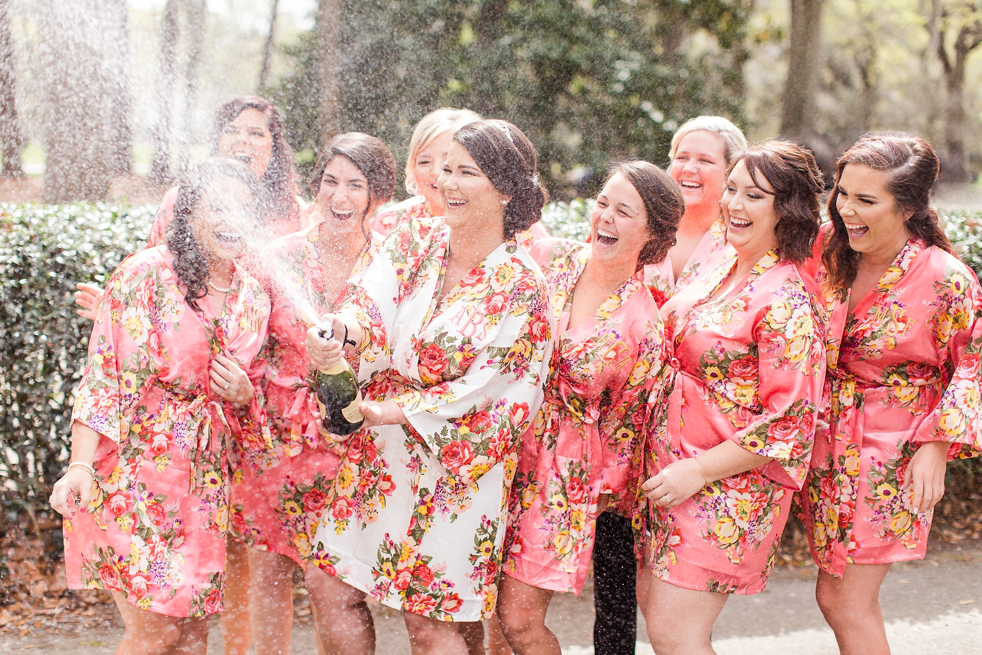 bridesmaids champagne popping photo