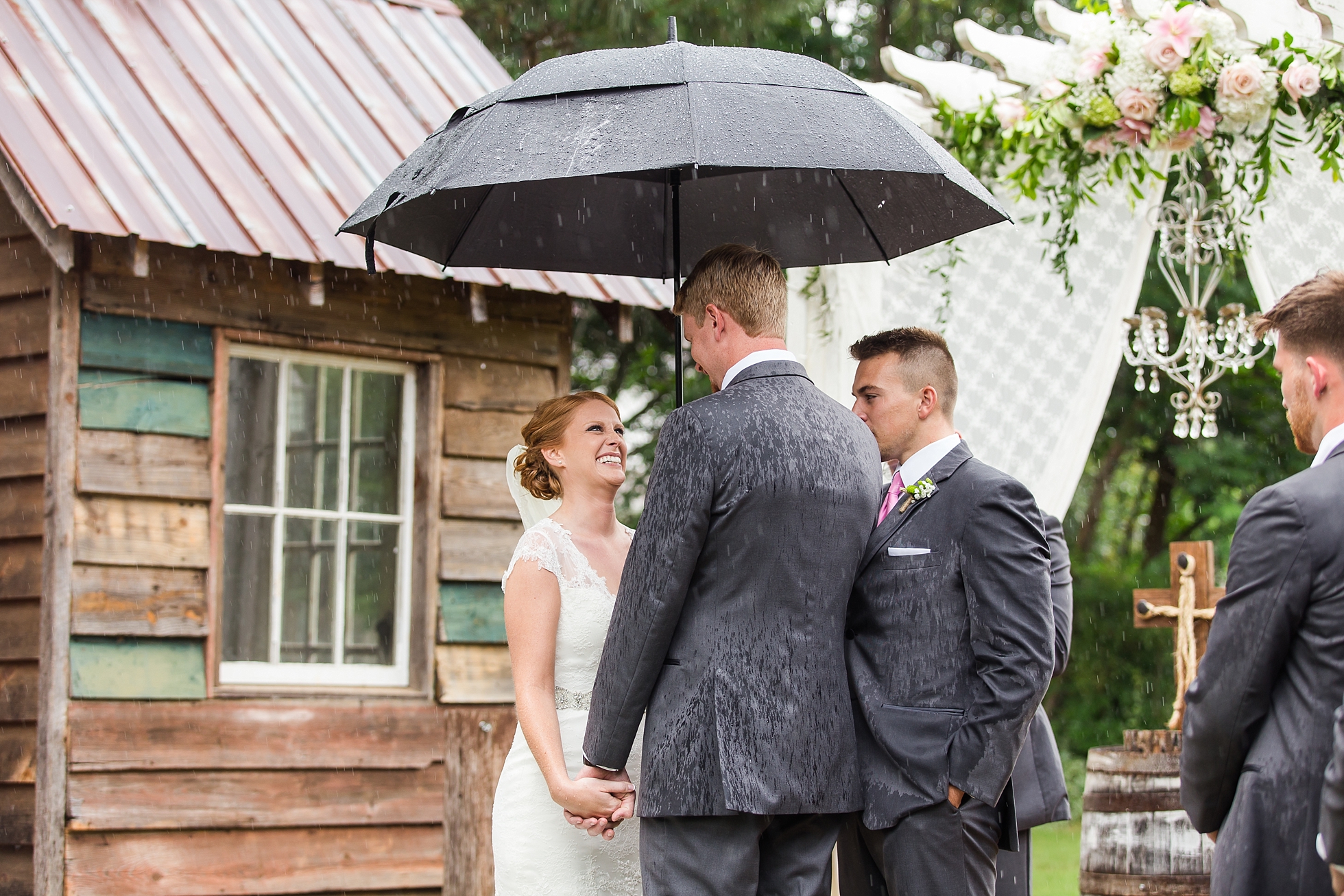 rainy wedding ceremony outdoor umbrellas