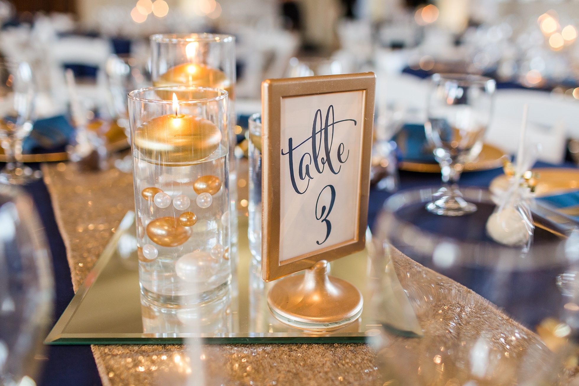 gold navy wedding reception table decor