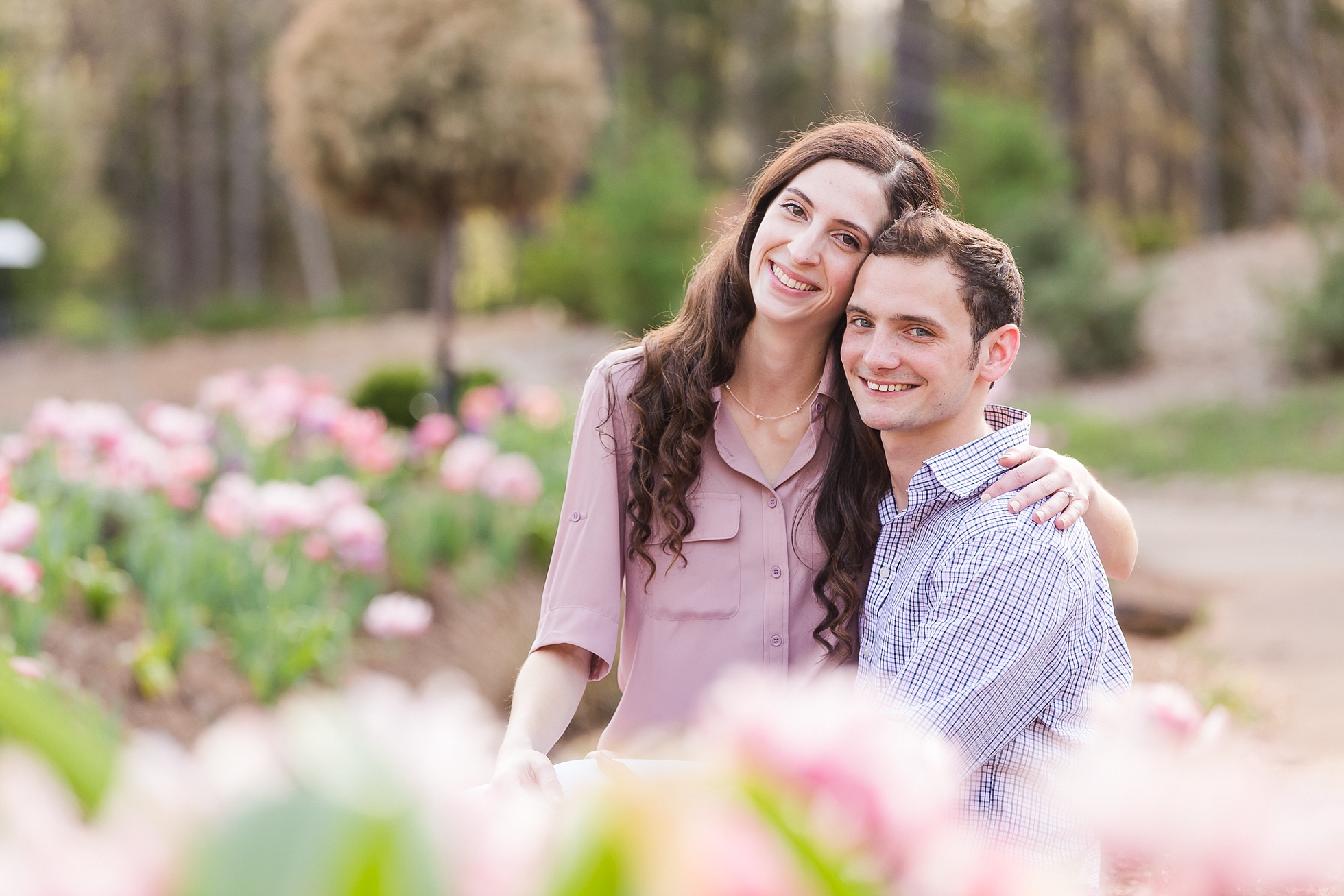 pink flowers engagement photos