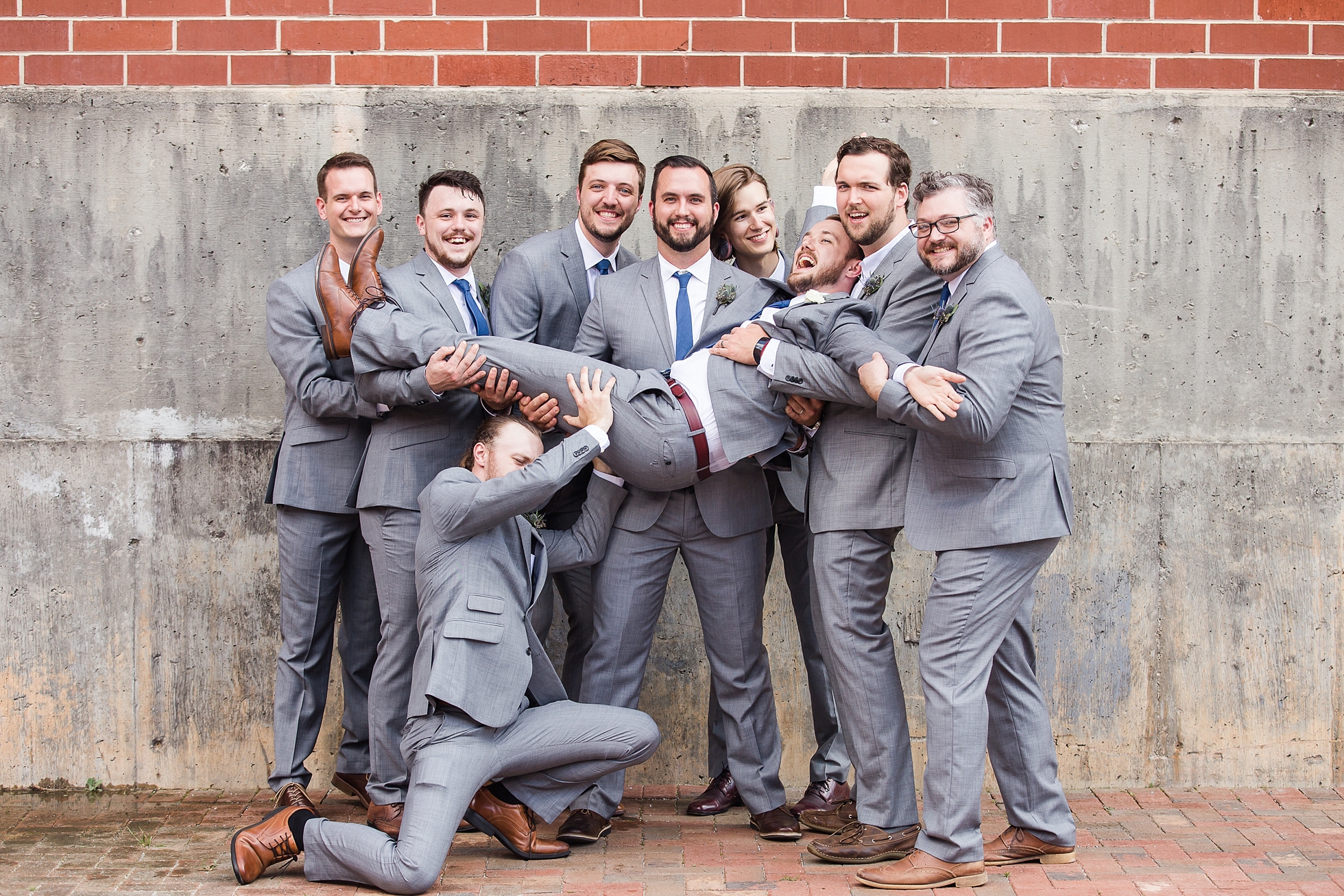 wedding groomsmen fun candid silly