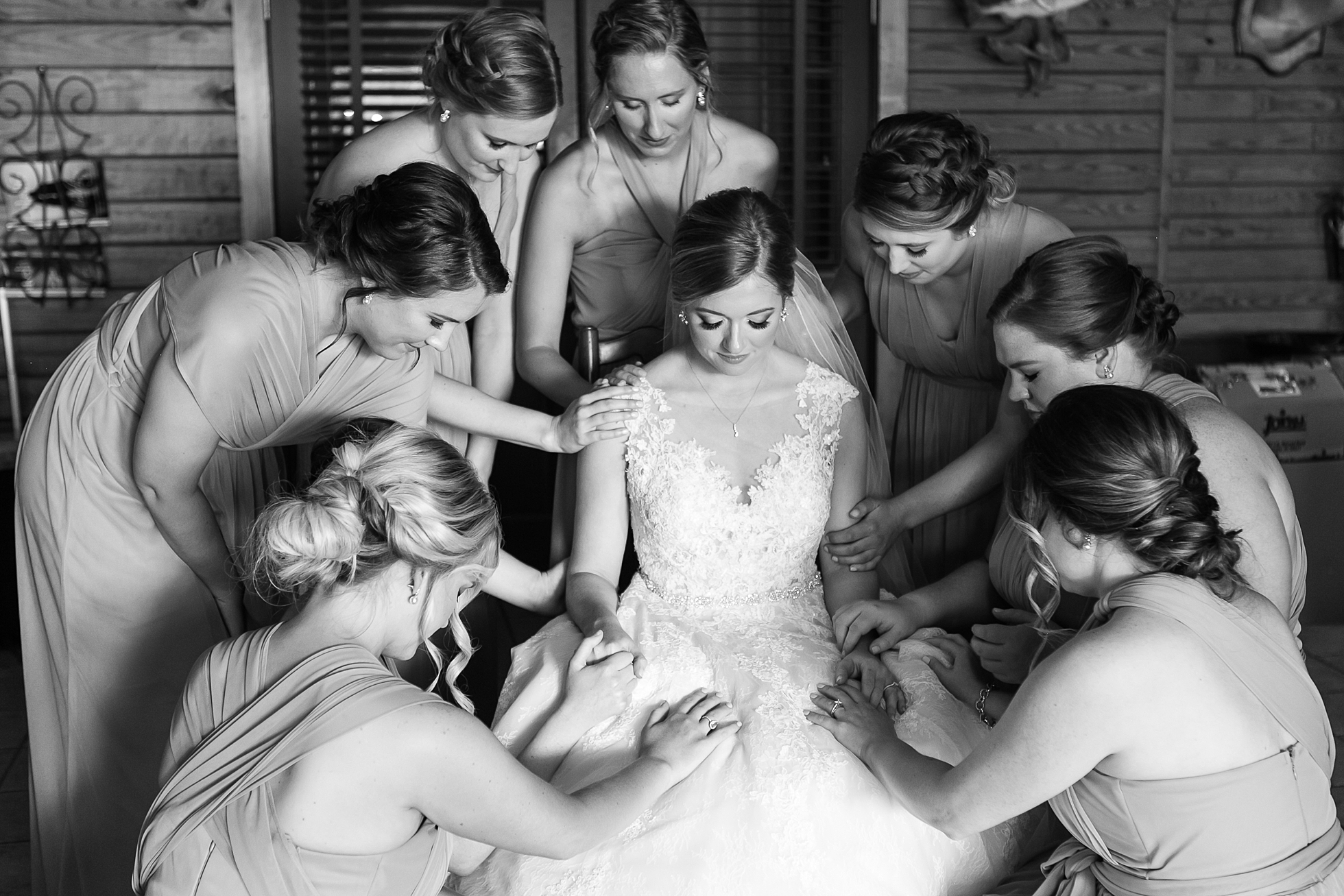 bridesmaids praying wedding