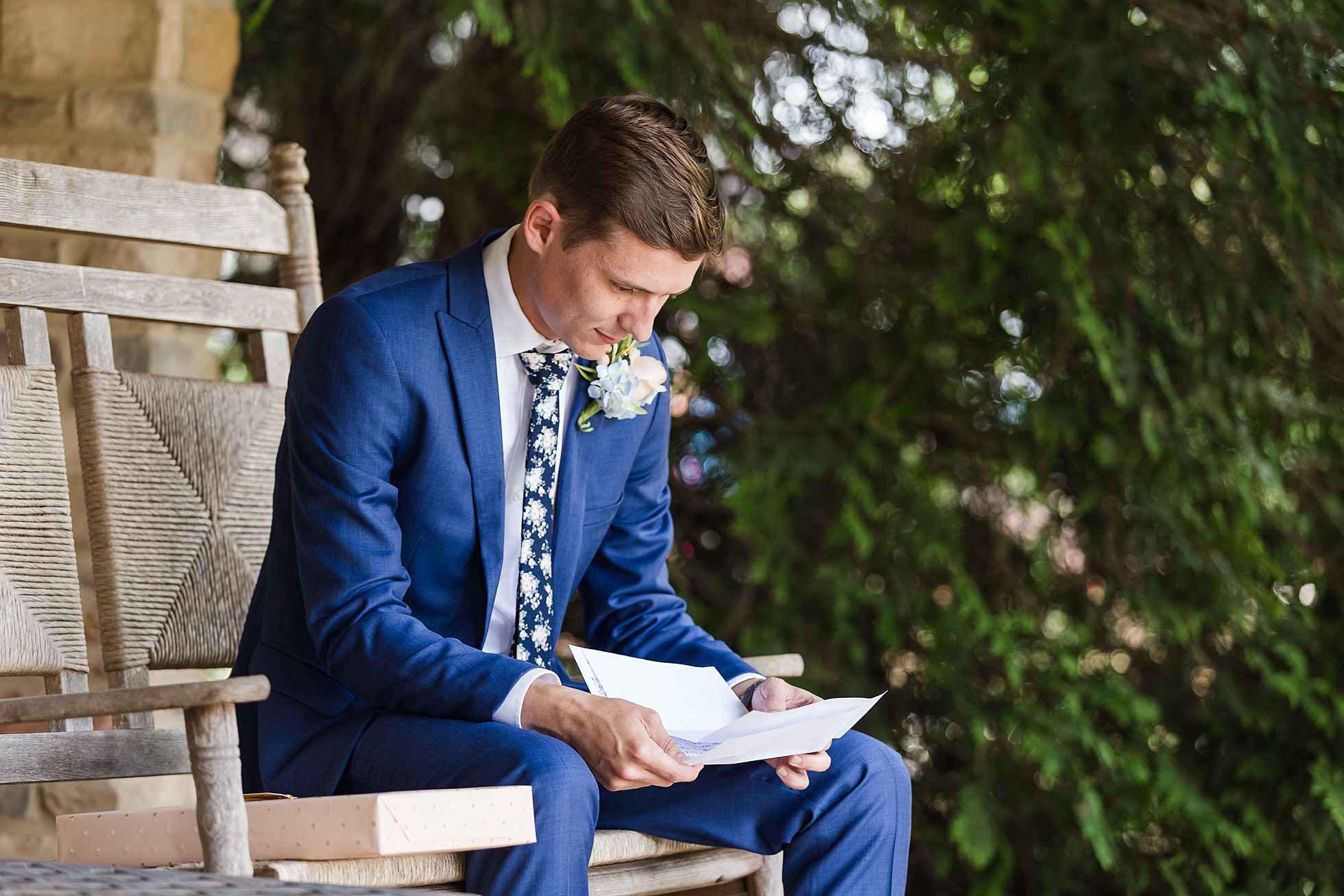 groom reading letter wedding