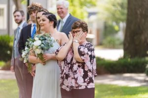 emotional wedding guest crying