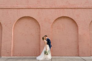 savannah pink house wall wedding couple