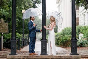 rainy wedding arch athens umbrellas