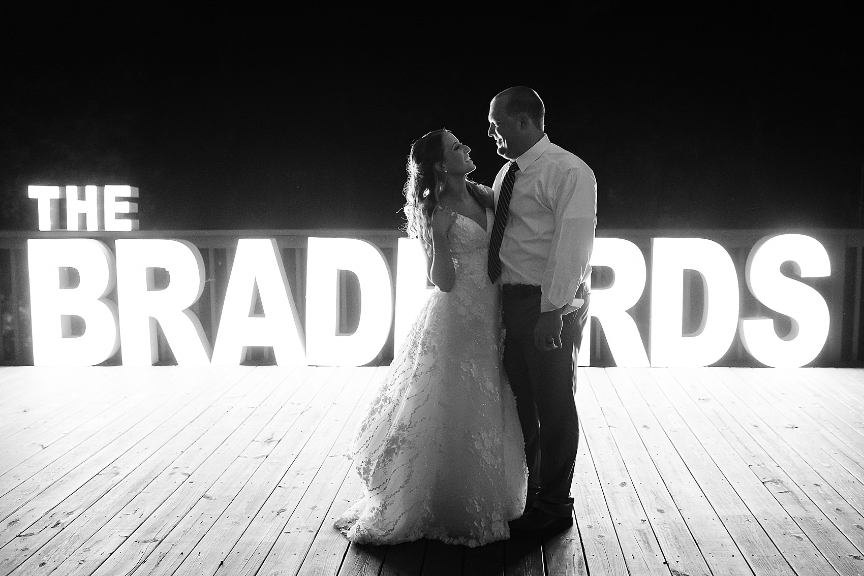 marquee lights wedding portrait