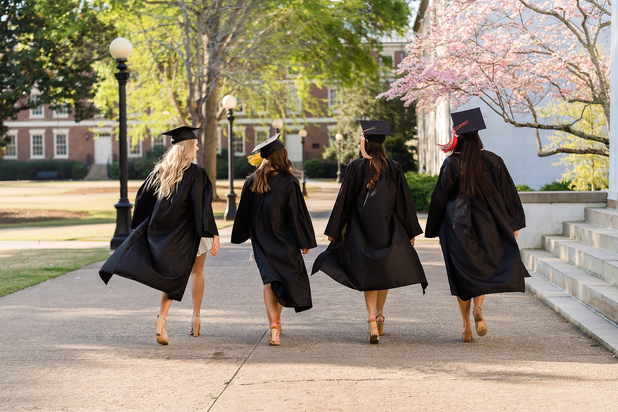 seniors grads walking cap gown