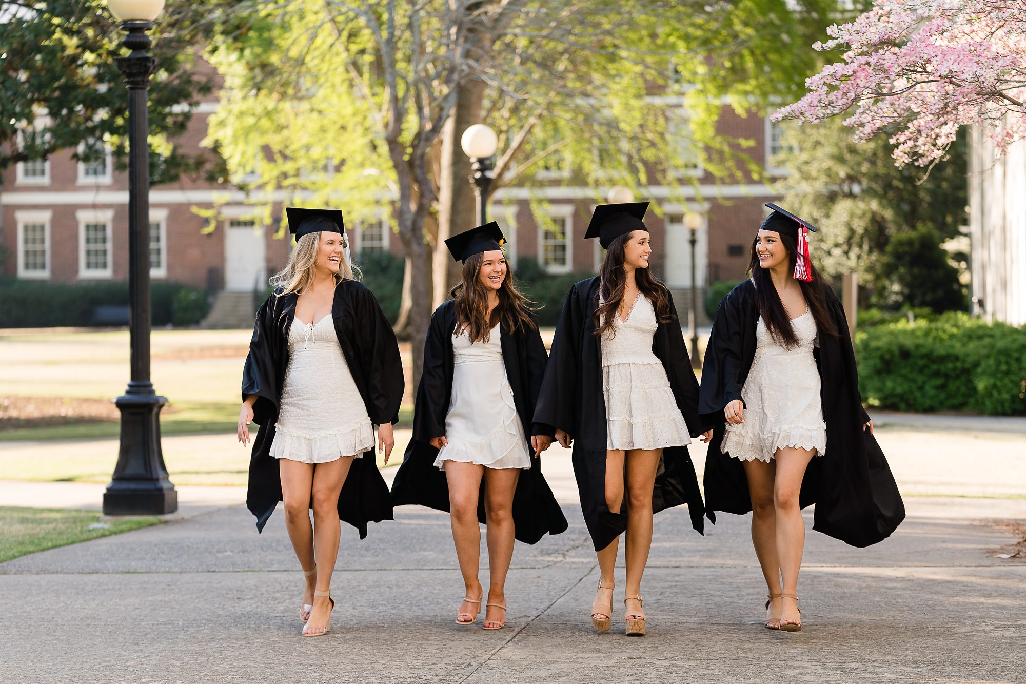 seniors grads walking cap gown