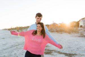 beach engagement couple love sunset