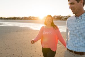 beach engagement couple love sunset